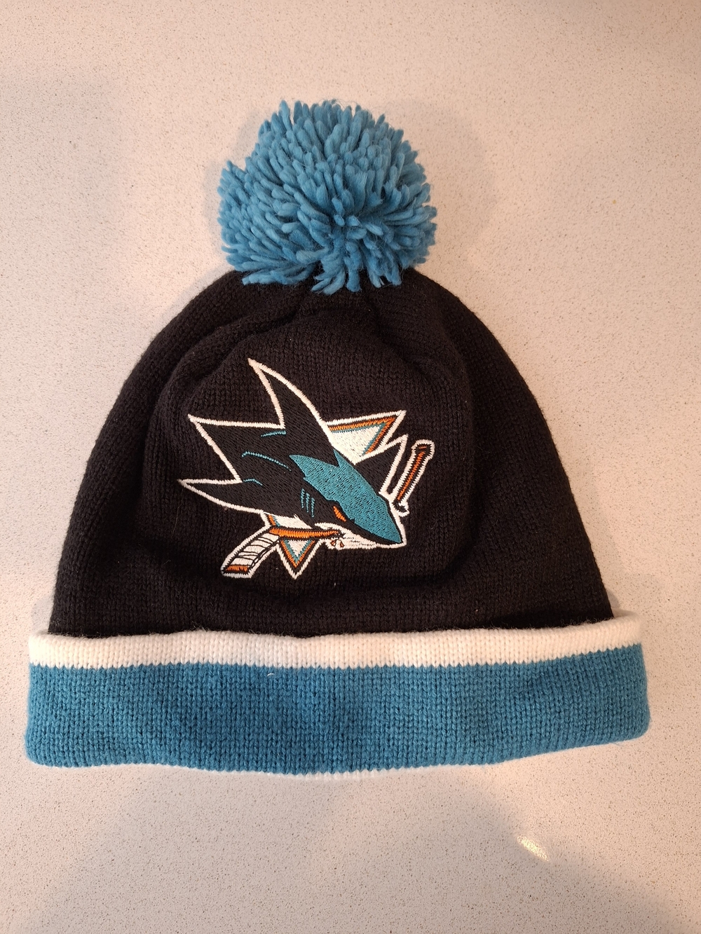 Mitchell & Ness Sharks Pom Beanie in Black, Teal, White